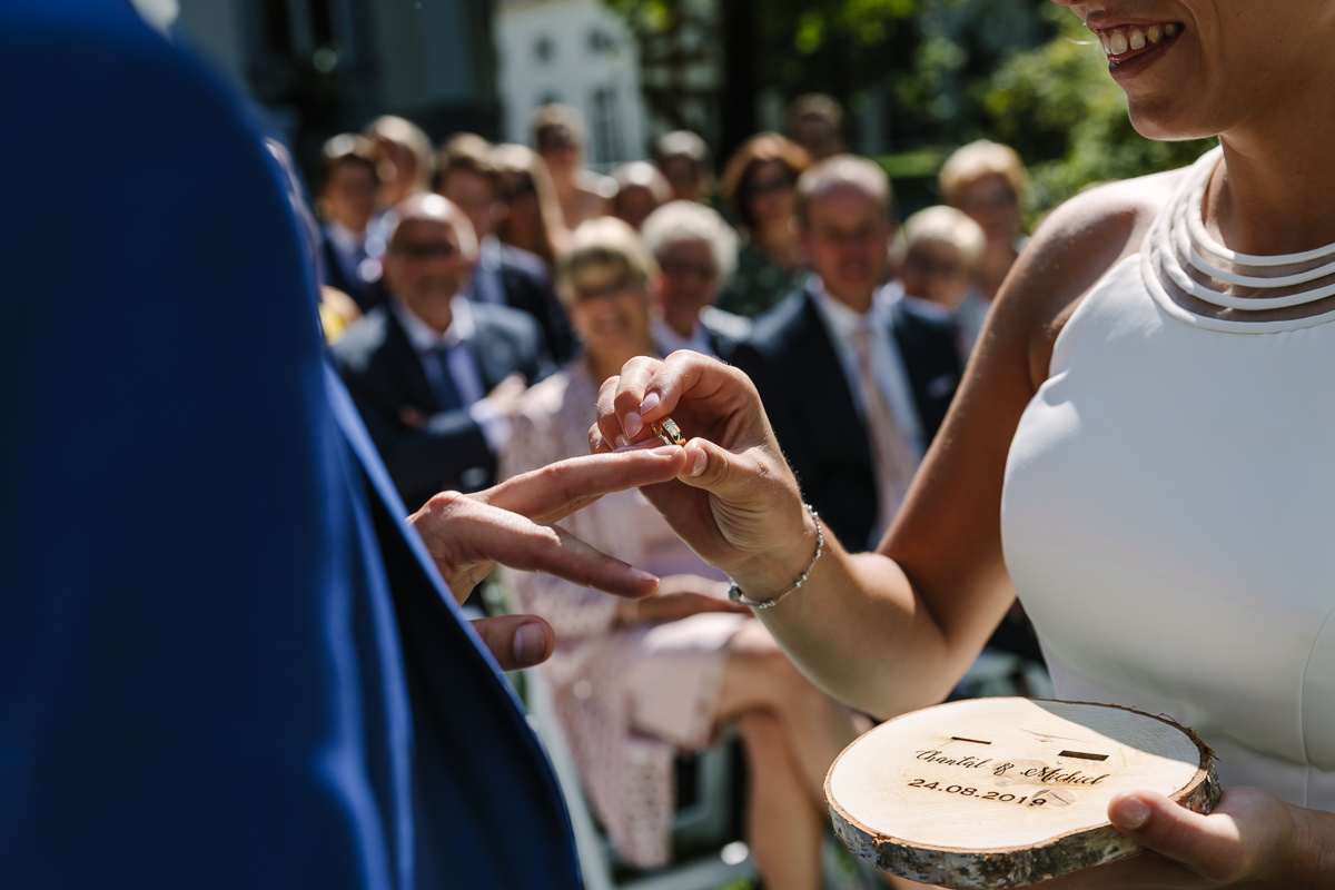exchange rings during wedding ceremony wedding photo journalistic documentary reportage photographer photo surrey
