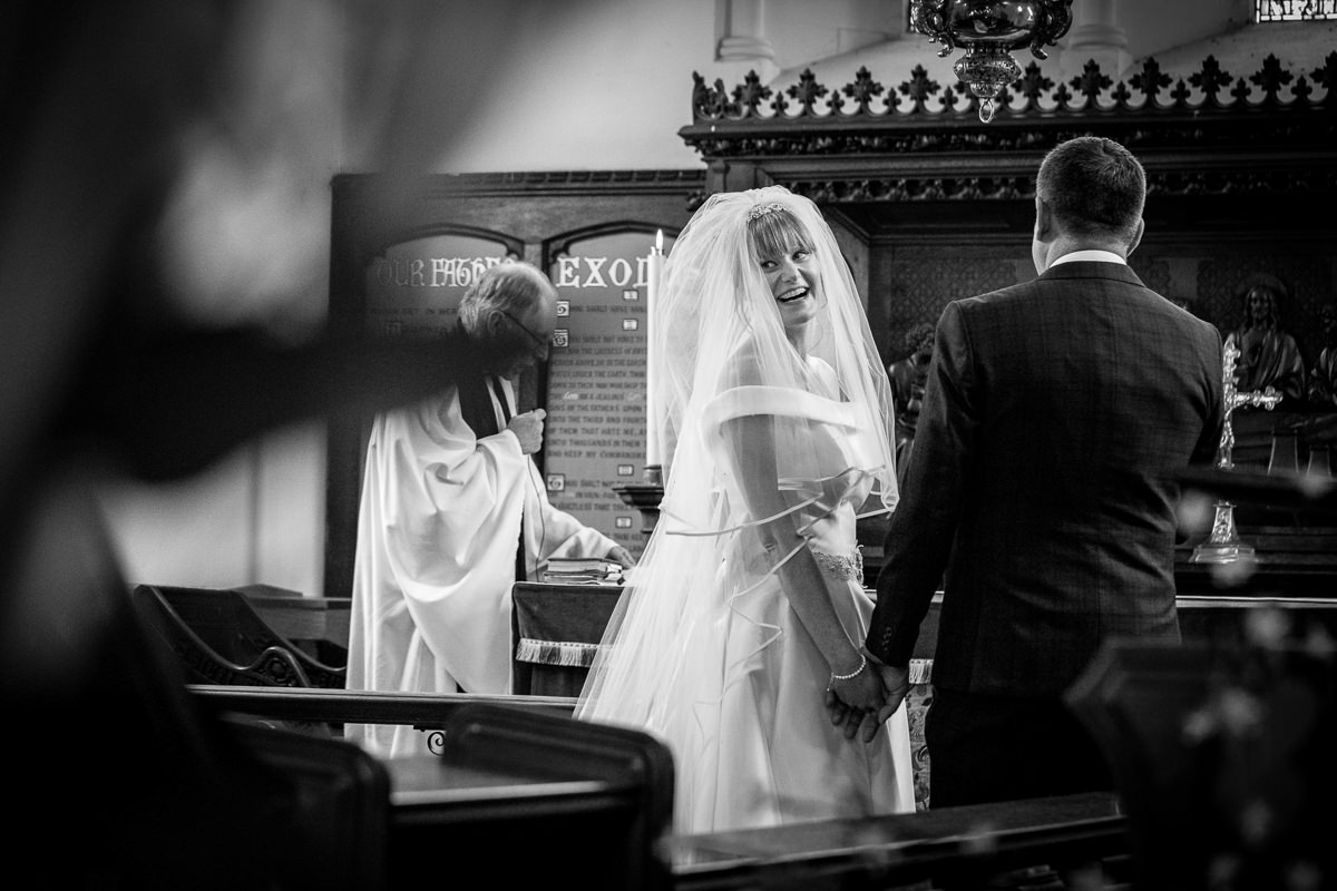 brockham christ church wedding ceremony bride groom surrey natural and authentic wedding portraits by documentary wedding photographer surrey and sussex