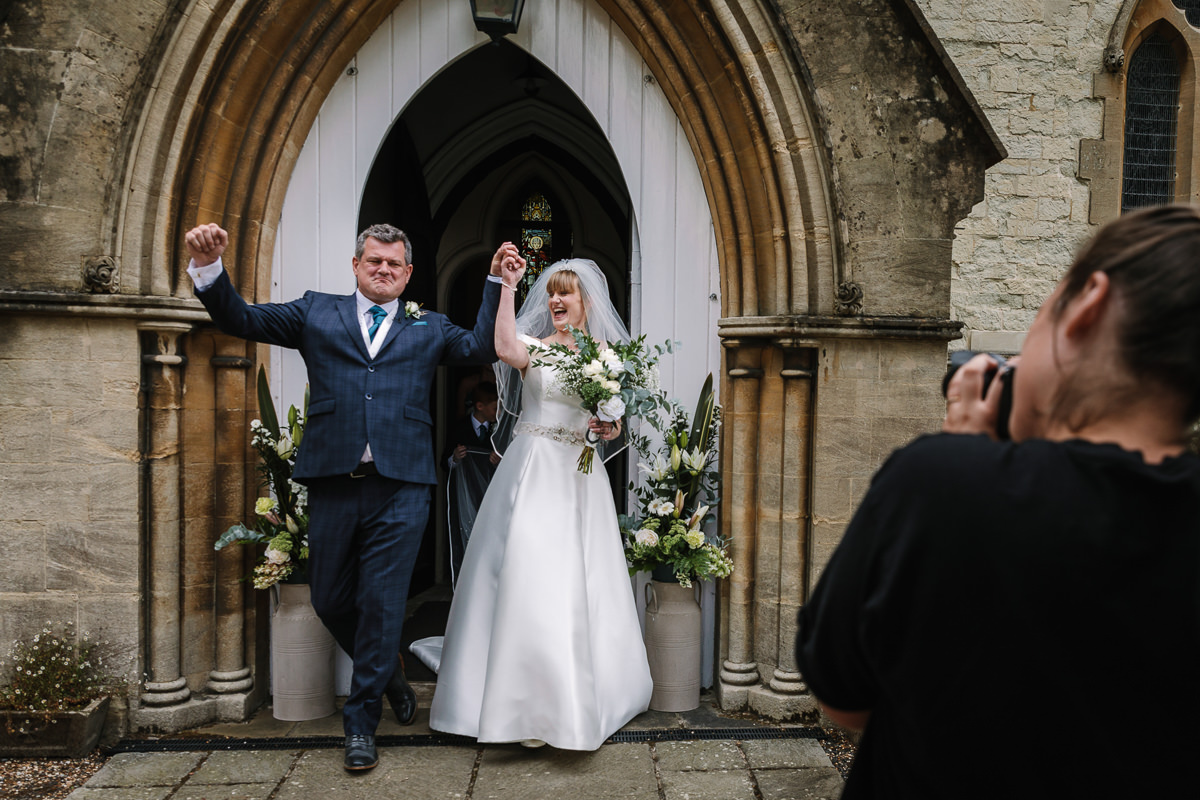 couple tied the knot at brockham christ church wedding ceremony bride groom surrey natural and authentic wedding portraits by documentary wedding photographer surrey and sussex
