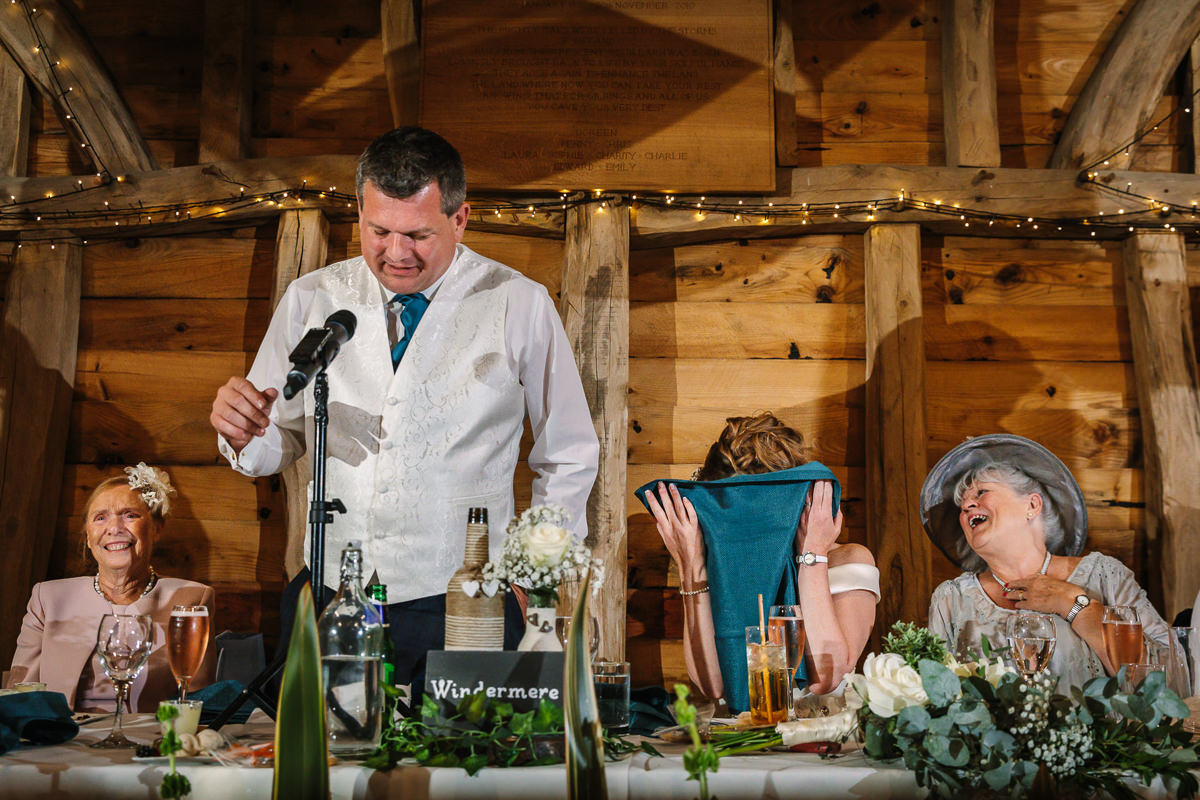funny hilarious wedding breakfast speeches at barn wedding venue gildings farm newdigate surrey for natural authentic wedding portraits by documentary wedding photographer