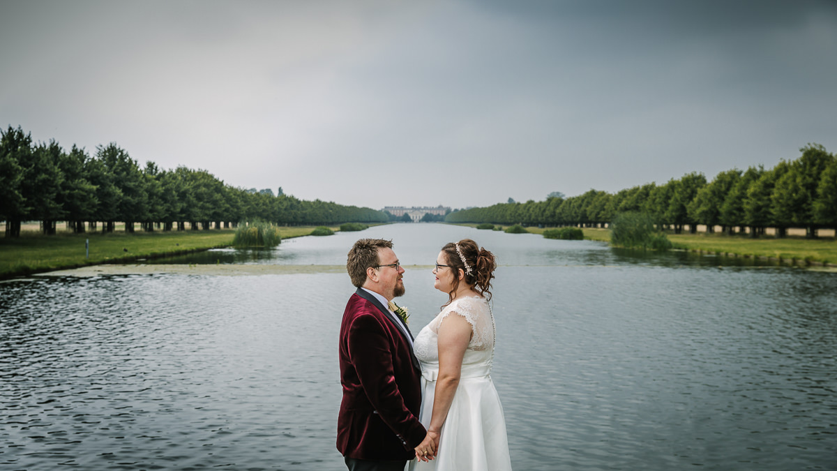 bride and groom wedding couple outdoor portraits at grounds of hampton court palace golf club wedding venue natural light authentic documentary couple photo nature