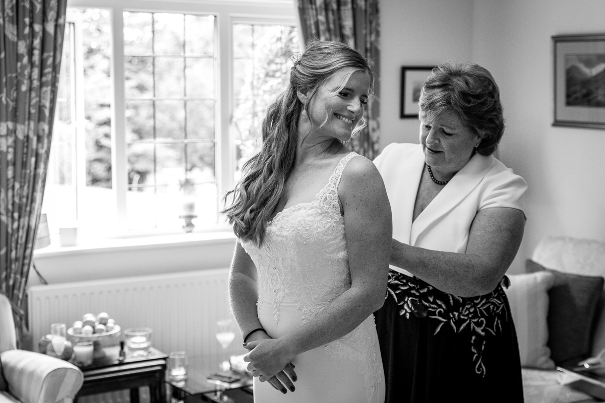 bride and mother during bridal prep on wedding day black_white image natural authentic documentary wedding photo photographer surrey sussex