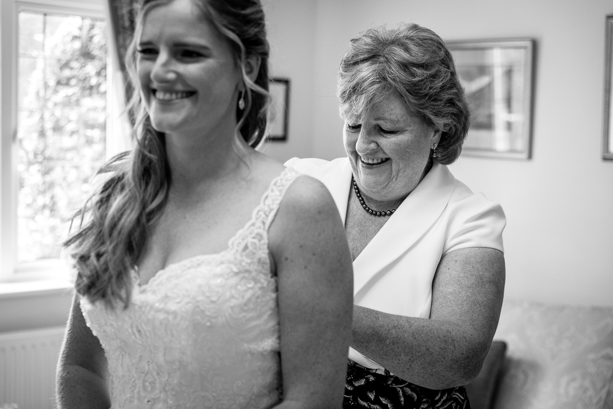 bride and mother bridal prep on wedding day black_white image natural authentic documentary wedding photo photographer surrey sussex