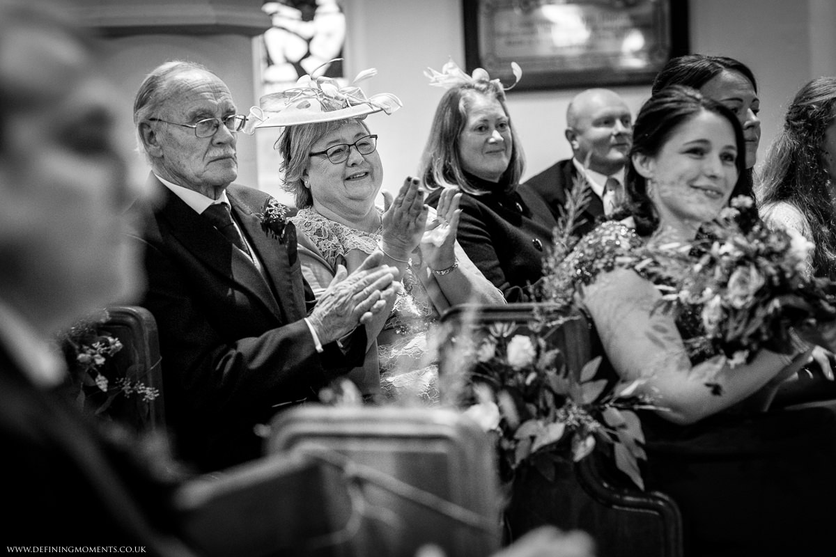 wedding at st_peter church newdigate religious ceremony black_white image natural and authentic wedding portraits by documentary wedding photographer guildford surrey and horsham west_sussex