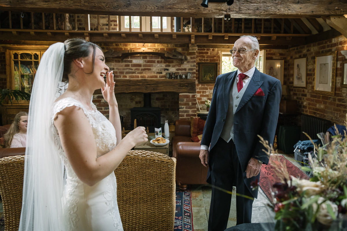 first look between father of the bride and bride by lgbtq_friendly documentary wedding photographer surrey for natural candid colourful authentic unposed wedding photography