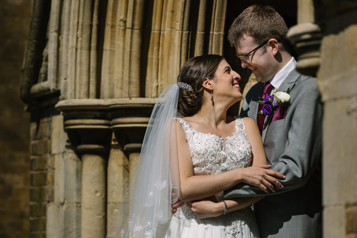 bride and groom portrait at st._johns_church redhill by lgbtq_friendly documentary wedding photographer surrey for natural candid colourful authentic unposed wedding photography