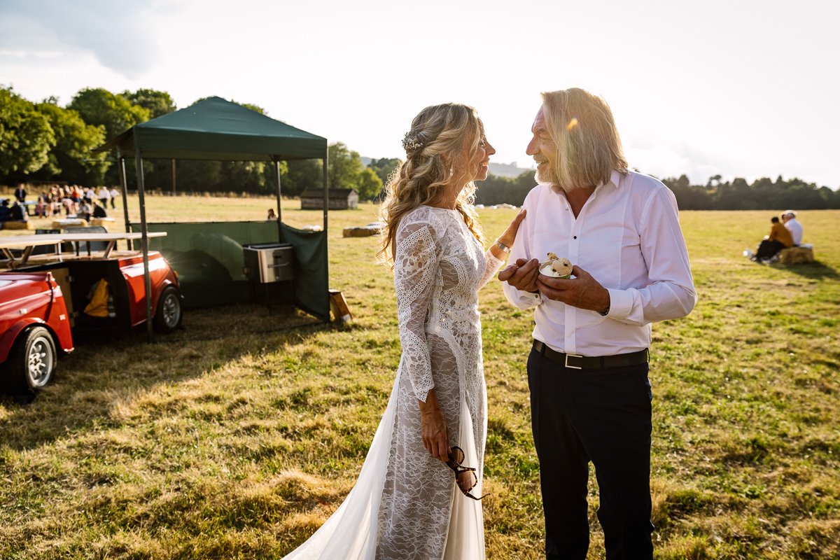 bride and groom during golden hour at outdoor tipi wedding dorking surrey by documentary wedding photographer sussex for candid natural unposed authentic LGBTQ_friendly documentary photography