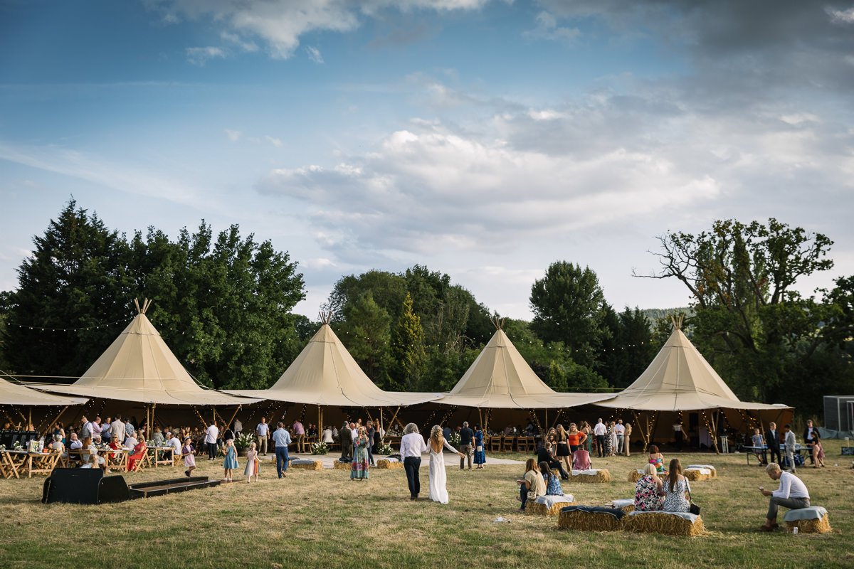 outdoor tipi wedding dorking surrey by documentary wedding photographer sussex for candid natural unposed authentic LGBTQ_friendly documentary photography