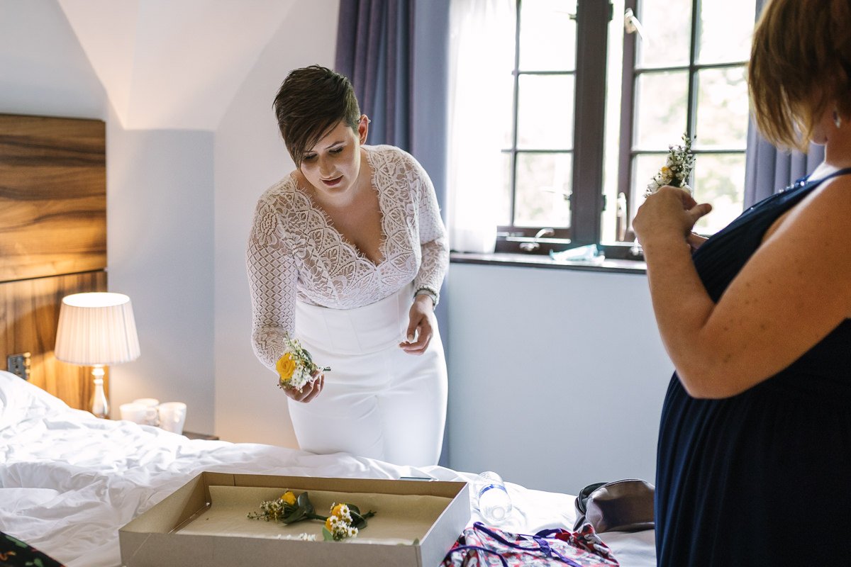 bride getting ready for same_sex gay wedding at gildings_barns with natural unposed candid photography by LGBTQ friendly wedding photographer surrey sussex