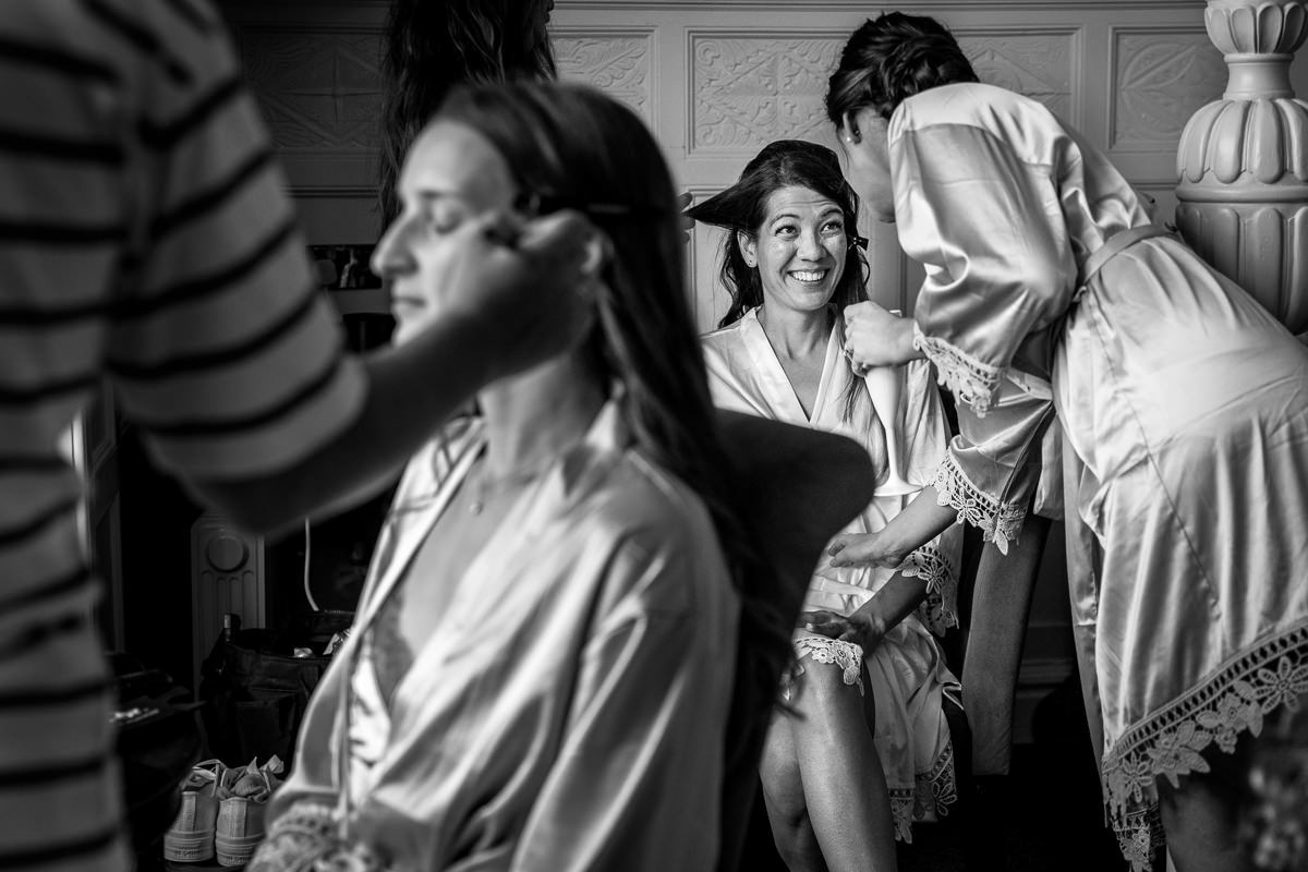 bride getting ready for same_sex gay wedding at gildings_barns with natural unposed candid photography by LGBTQ friendly wedding photographer surrey sussex