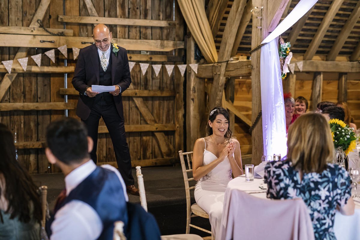wedding breakfast speech father_of_the_bride at same_sex gay wedding at gildings_barns with natural unposed candid photography by LGBTQ friendly wedding photographer surrey sussex