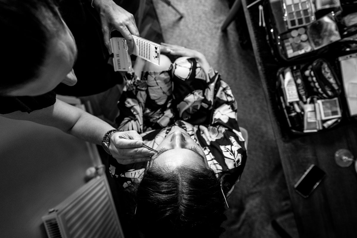 black_and_white image top view Bridal prep by lgbtq_friendly documentary wedding photographer surrey Sussex for natural candid colourful authentic unposed relaxed wedding photography