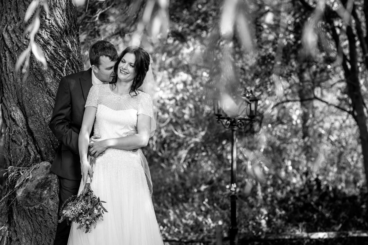 black_and_white image bride groom outdoor wedding portrait at barn wedding venue kent the_plough_at_leigh by documentary wedding photographer surrey sussex for natural colourful and authentic LGBTQ_friendly wedding photography