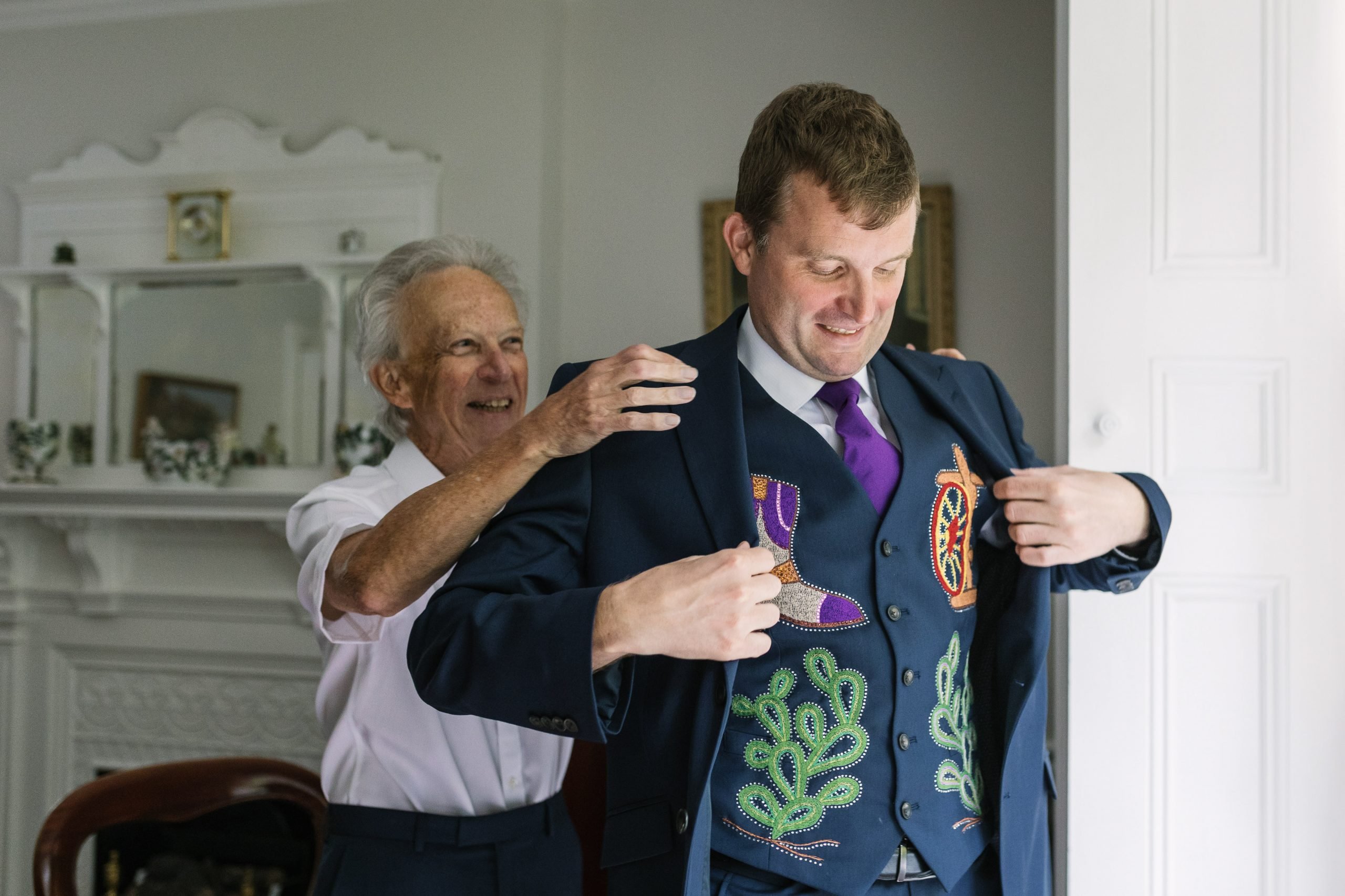 groom prep wedding day father_of_the_groom natural unposed candid wedding photography by LGBTQ_friendly documentary wedding photographer surrey sussex