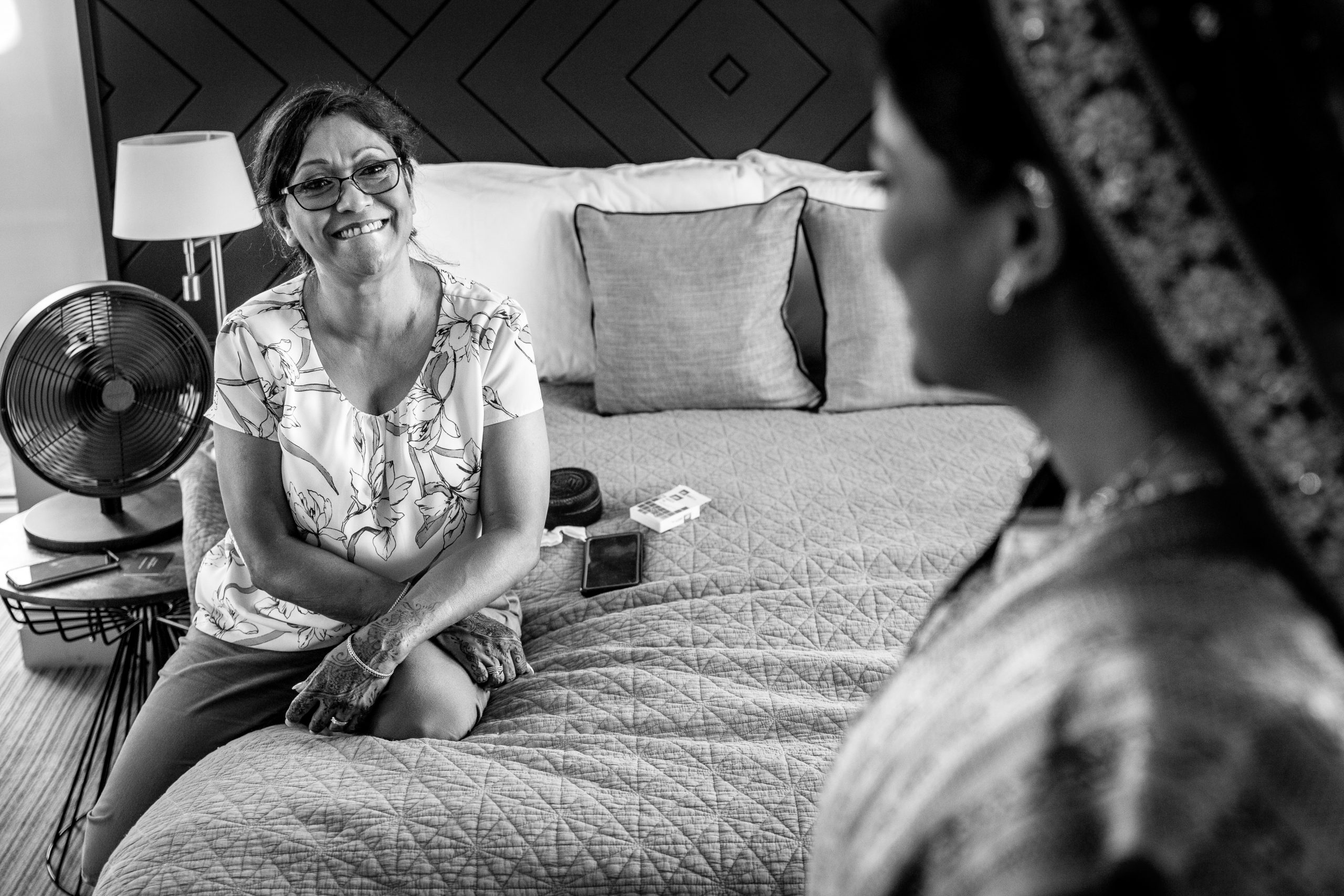 mother_of_the_bride looking lovingly at bride during bridal prep of indian fusion wedding at denbies dorking natural unposed candid wedding photography by LGBTQ_friendly documentary wedding photographer surrey sussex