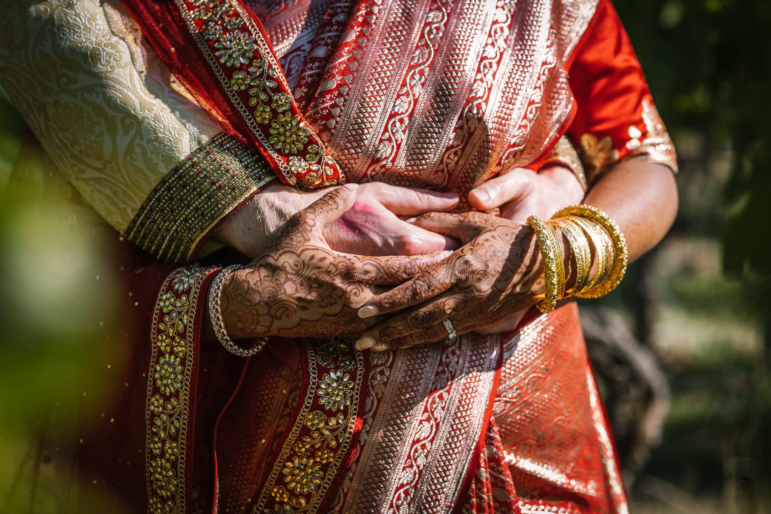 bride and groom holding hands close_up image natural unposed candid wedding photography by LGBTQ_friendly documentary wedding photographer surrey sussex