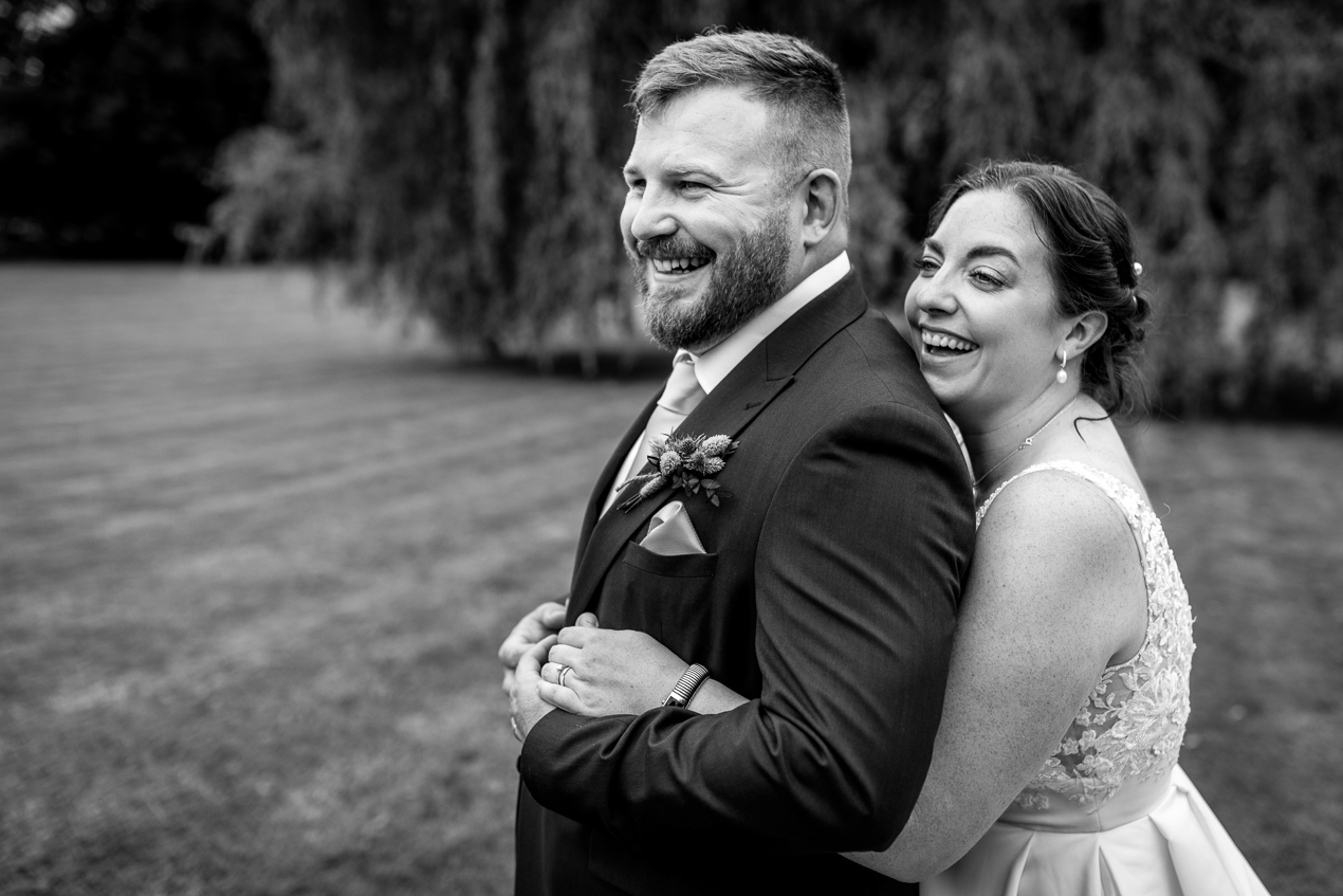 bride and groom outdoor portrait during wedding at Hartsfield_Manor_wedding Surrey by documentary wedding photographer surrey for candid natural unposed authentic documentary photography