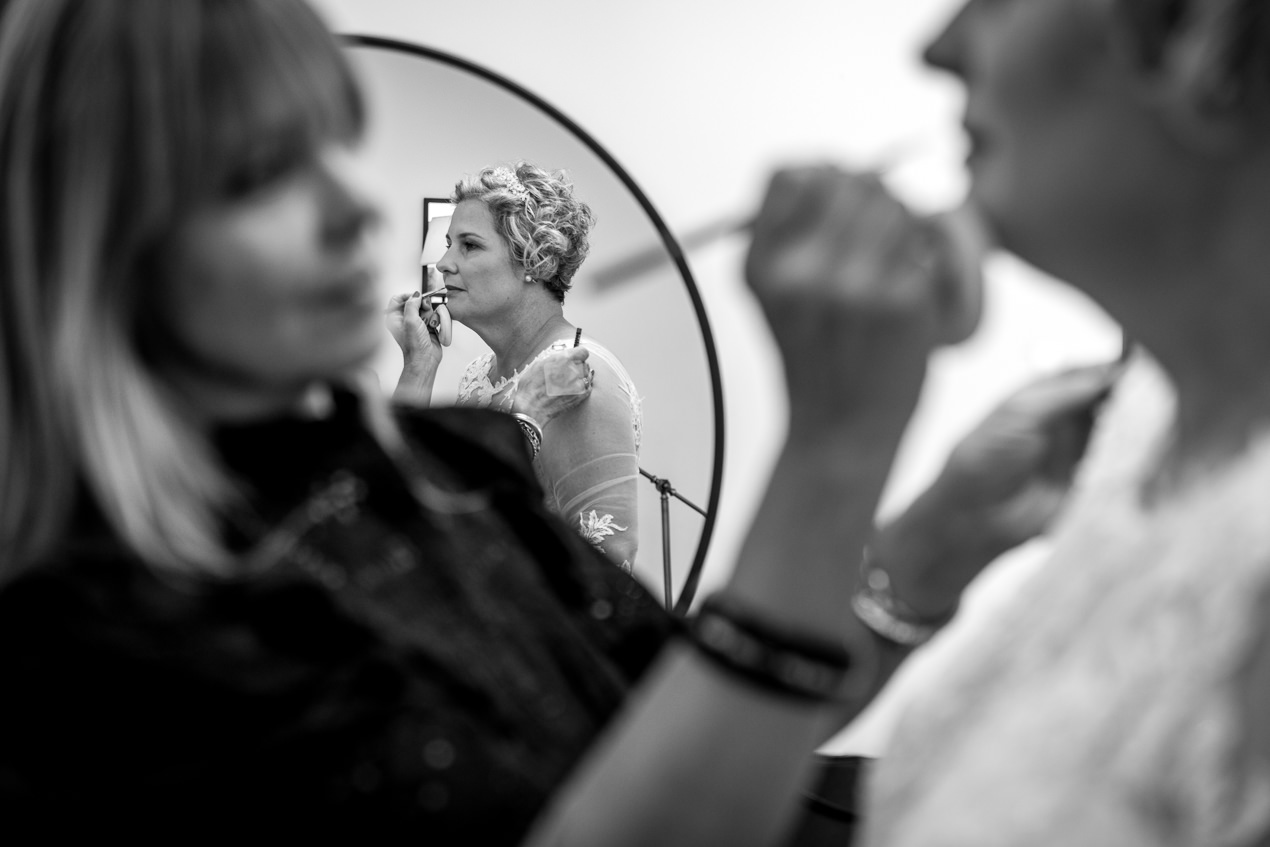 last touches of bridal prep at gate_street_barn wedding storytelling wedding photography by documentary wedding photographer surrey sussex