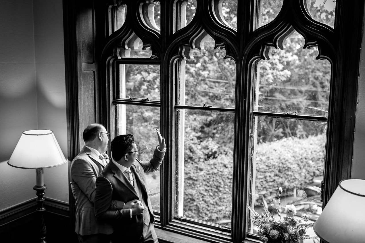 couple portraits in black and white with grooms during same_sex gay wedding nutfield_priory natural candid unposed natural storytelling wedding photography by documentary lgbtq_friendly wedding photographer surrey sussex