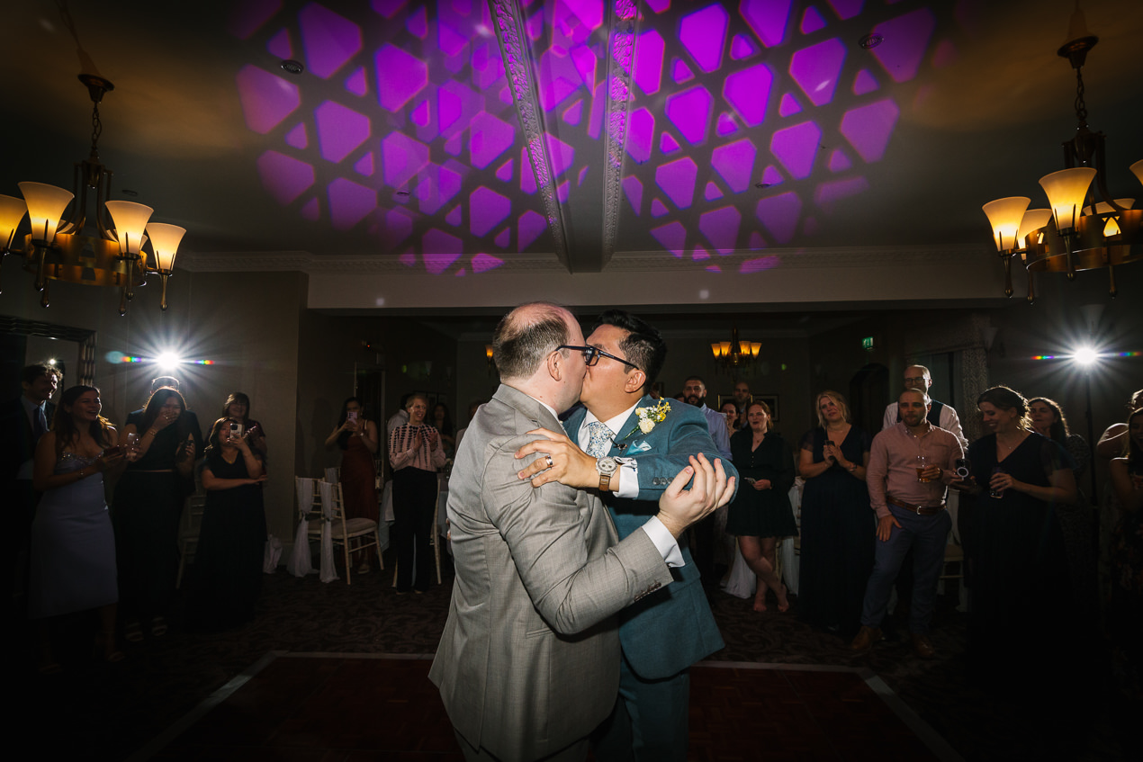 grooms first dance at same_sex gay wedding nutfield_priory natural candid unposed natural storytelling wedding photography by documentary lgbtq_friendly wedding photographer surrey sussex